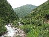 Sichuan:Xiaojin Xian. SW of the city of Xiaojin at Shalong Xiang. View upstream in main valley.