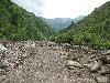 Sichuan: Xiaojin Xian. SW of the city of Xiaojin at Shalong Xiang. Riverbed scoured clean of vegetation by recent flood.