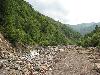 Sichuan: Xiaojin Xian. SW of the city of Xiaojin at Shalong Xiang. Riverbed scoured clean of vegetation by recent flood.