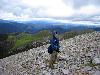 Sichuan, Xiangcheng Xian.  Vicinity of the town of Reda. Rizhao Shen Shan, upper elevations.  Rick Ree near summit of Rizhao Shen Shan